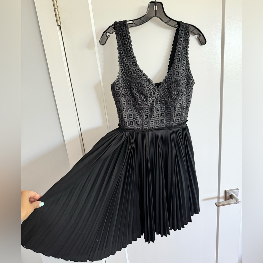 black pleated cocktail dress